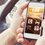 Car,Insurance,Concept,,Driver,Reading,Website,On,Smartphone