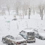 Heavy,Blizzard,In,Town.,Cars,With,Snow,Covered,On,Parking