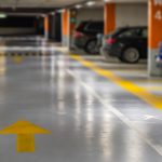 Yellow,Markings,With,Blurred,Modern,Cars,Parked,Inside,Closed,Underground