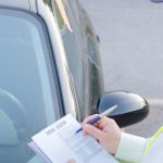 Police,Officer,Giving,A,Ticket,Fine,For,Parking,Violation