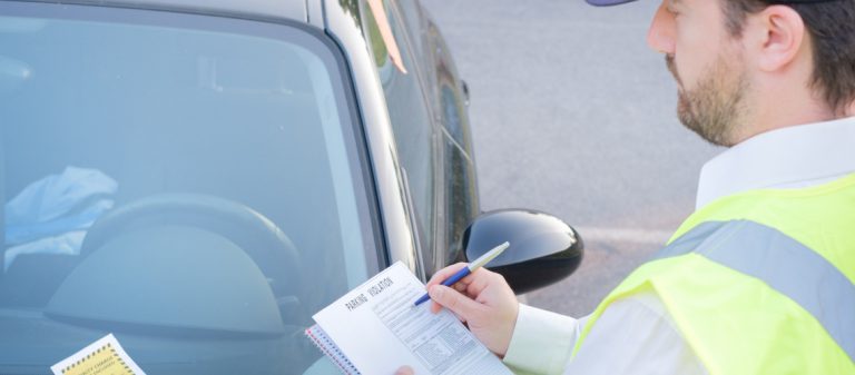 Police,Officer,Giving,A,Ticket,Fine,For,Parking,Violation