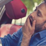 Sleepy,Fatigued,Yawning,Exhausted,Young,Man,Driving,His,Car,In