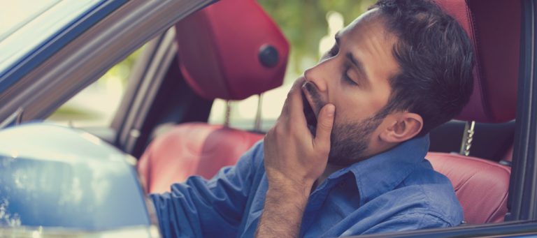 Sleepy,Fatigued,Yawning,Exhausted,Young,Man,Driving,His,Car,In