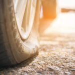 Selective,Focus,Flat,Tire,Of,Old,Car,Park,On,The