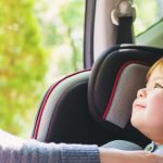 Toddler,Girl,Buckled,Into,Her,Car,Seat