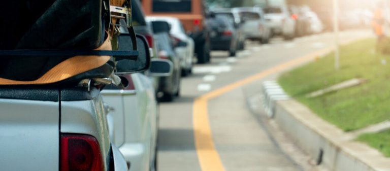 Cars,Parked,On,An,Asphalt,Road,For,Long-distance,Travel,Or