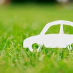 Paper,Cut,Of,Car,On,Green,Grass