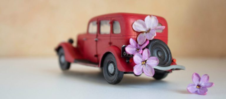 Miniature,Toy,Red,Retro,Car,On,A,White,Background.,Red