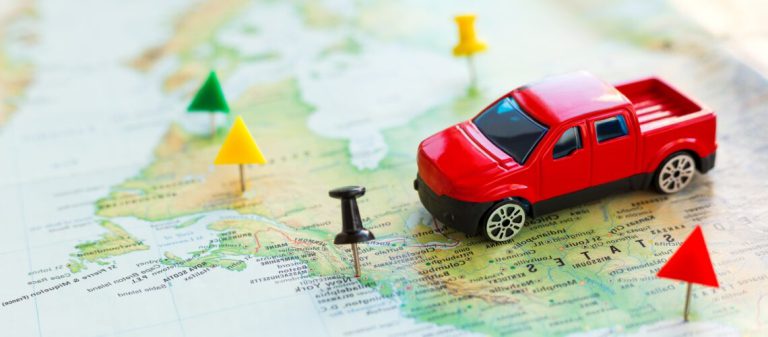 Road,Trip,At,Homeland,-,Red,Car,Goes,On,Map
