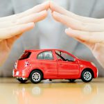 Businesswoman,Hands,And,Car,As,Protection,Of,Car,Concept