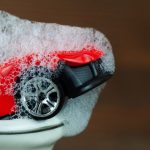 Toy,Car,In,The,Bathroom,With,Foam,,Car,Wash,Concept