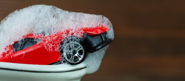 Toy,Car,In,The,Bathroom,With,Foam,,Car,Wash,Concept
